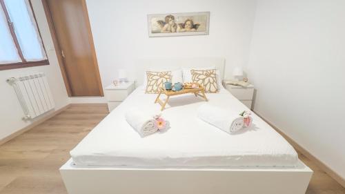 Postel nebo postele na pokoji v ubytování La Casa di Clelia by Ca-Sa Check