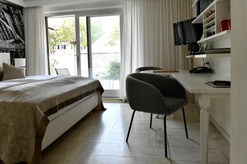 Ένα ή περισσότερα κρεβάτια σε δωμάτιο στο Villa Mittermeier, Hotellerie & Restaurant