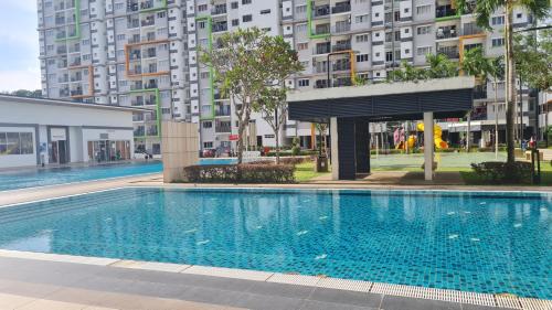 a swimming pool in the middle of a building at EcoHill Serenity Suites in Semenyih