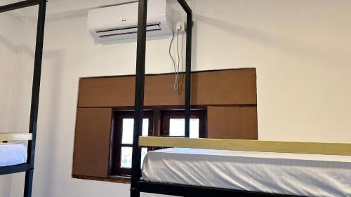 a bunk bed in a room with a window at Wake N Flow, Ahangama - Kabalana Beach in Ahangama