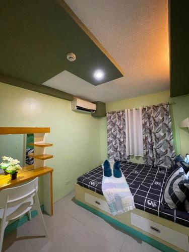Ένα ή περισσότερα κρεβάτια σε δωμάτιο στο One Oasis Davao Condiminium