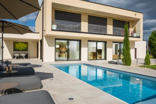 an image of a house with a swimming pool at Palazzo Verde in Würzburg in Würzburg