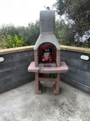 a brick oven sitting on top of a bench at Villamonte Colonna in Patti