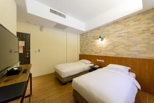 Una cama o camas en una habitación de 杰克山莊渡假大飯店