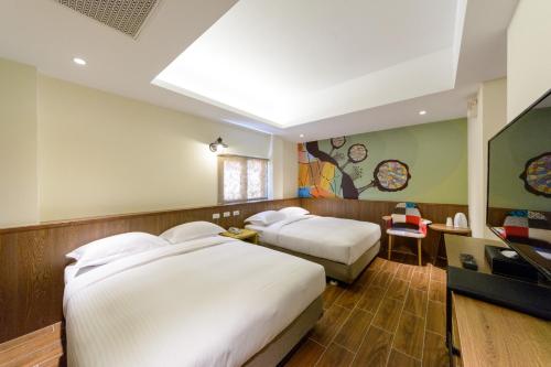 Una cama o camas en una habitación de 杰克山莊渡假大飯店