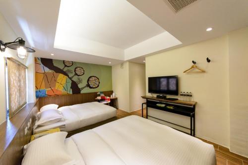 Una cama o camas en una habitación de 杰克山莊渡假大飯店