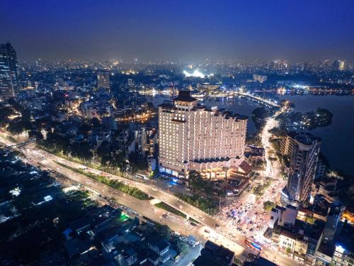 an aerial view of a city at night at Pan Pacific Hanoi in Hanoi