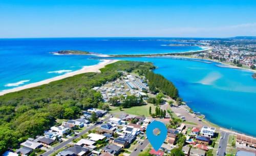an aerial view of a beach with a blue marker on it at DriftWood - Where the Lake Meets the Sea in Windang