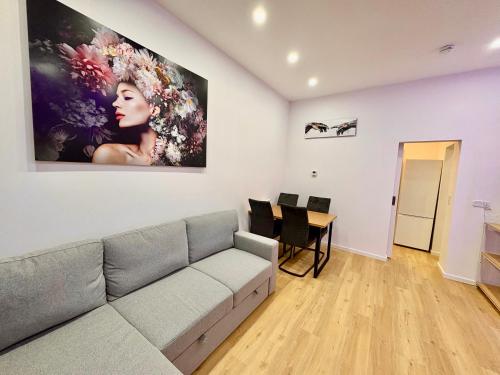 a living room with a couch and a table at City Line Koblenz in Koblenz