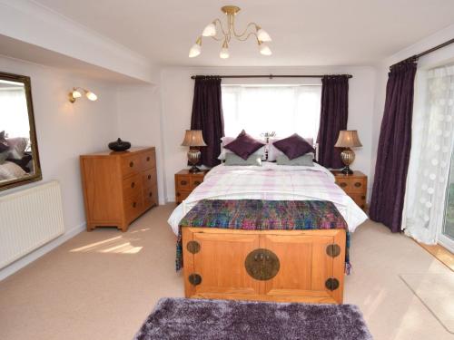 a bedroom with a large bed and a window at 1 Bed in Ashley Heath 50147 in Saint Ives