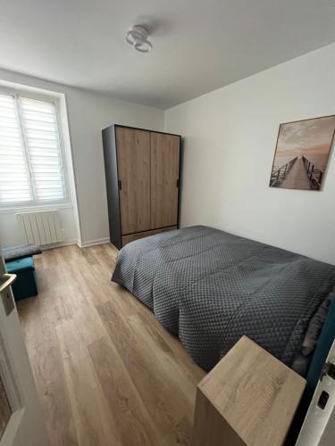 Ένα ή περισσότερα κρεβάτια σε δωμάτιο στο appartement