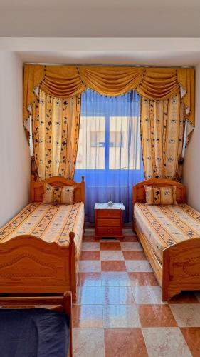 Ένα ή περισσότερα κρεβάτια σε δωμάτιο στο Seaview Apartments