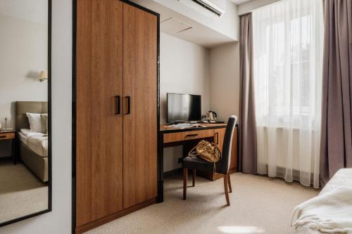 Katil atau katil-katil dalam bilik di Grottger Luxury Boutique Hotel City