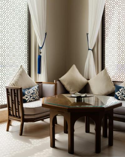 a living room with a couch and a coffee table at Banyan Tree Tamouda Bay in Fnidek