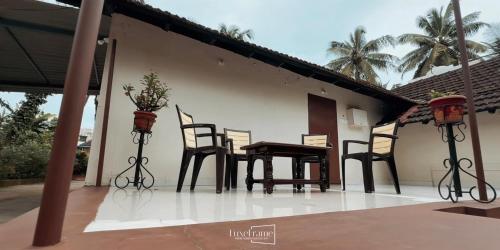 a table and chairs sitting on a patio at Aavasa Blu in Ullāl