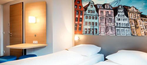 Кровать или кровати в номере B&B Hotel Rostock City-West