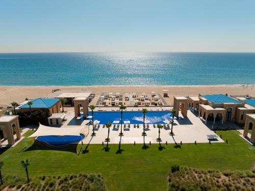 an aerial view of a resort with the beach at Banyan Tree Tamouda Bay in Fnidek