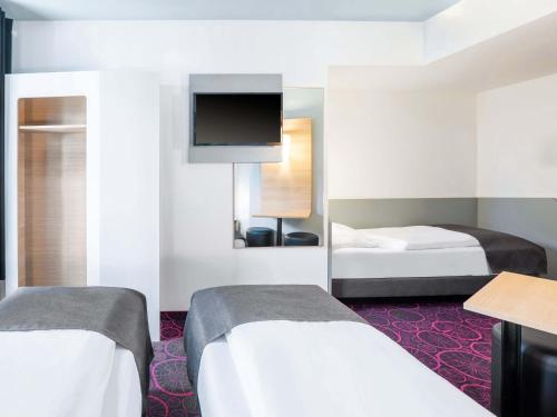 B&B Hotel Offenburg-Cityにあるベッド