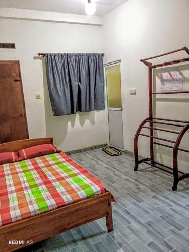 a bedroom with a bed and a bunk bed at Sanithu Homestay and villa Galle in Galle