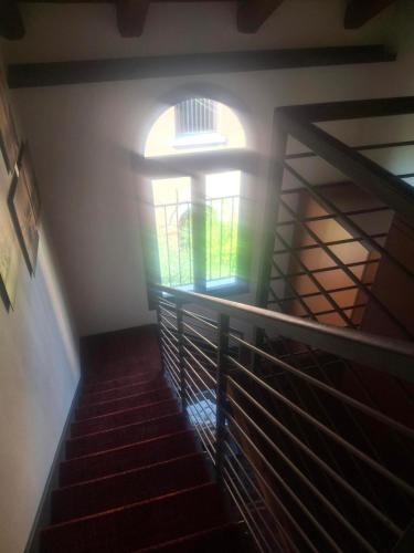 a stairway with a window in a building at Eurostars Residenza Cannaregio in Venice