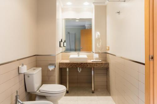 a bathroom with a toilet and a sink at Moon Dreams Atlantic in Es Cana