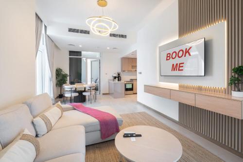 a living room with a couch and a table at Free housekeeping visits during your stay - StayShort - Business Bay for 4 people with City Views in Dubai