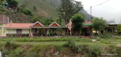 a house on the side of a mountain at Bablu hotel in Mussoorie