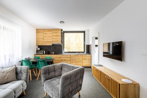 Μια τηλεόραση ή/και κέντρο ψυχαγωγίας στο Malino Resort & Residences - Chalets