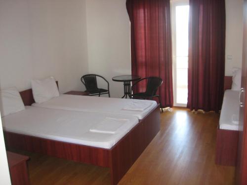 Postel nebo postele na pokoji v ubytování Apartmani Marija