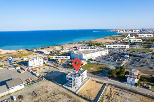 an aerial view of a city and the ocean at Artemis 302 - Seaside Stories in Livadhia