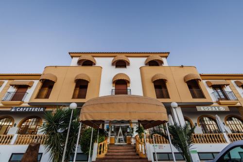 a building with a staircase in front of it at Hotel Acosta Vetonia in Almendralejo