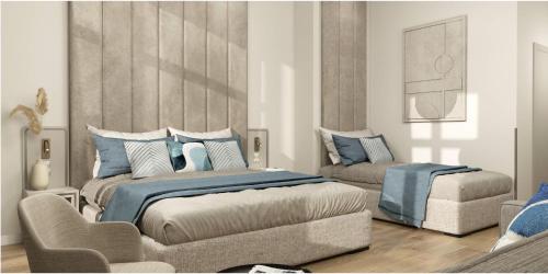 a bedroom with a king sized bed and a couch at Oysters & Bubbles Gastro Rooms Rynek Square in Poznań