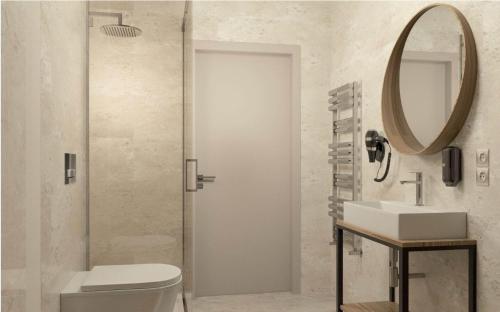 a bathroom with a toilet and a sink and a mirror at Oysters & Bubbles Gastro Rooms Rynek Square in Poznań