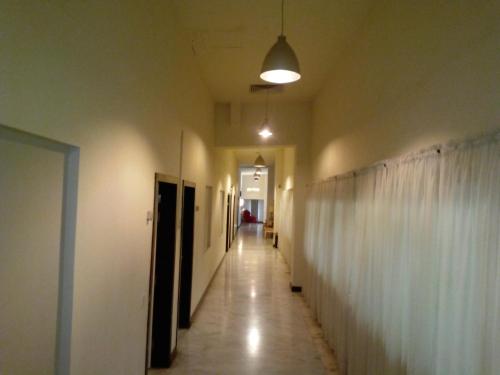 an empty hallway with a hallwayngthngthngthngthngthngthngthngthngthngth at The Enterprise in Karachi