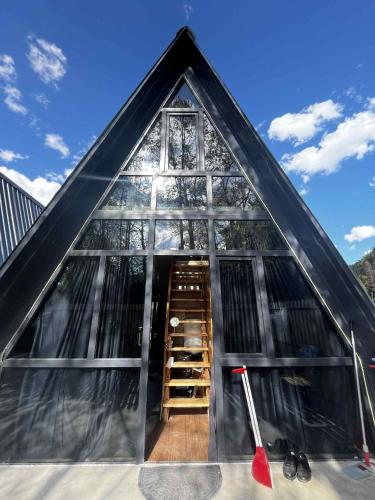 a small house with a staircase in the front of it at Chalet Adjara 