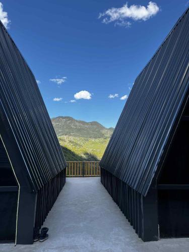 two black roofs of a house with a view at Chalet Adjara 