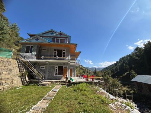a house sitting on top of a hill at River Era by Naavagat in Jibhi