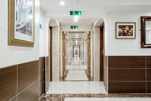 a corridor of a building with a hallway at Muthu Glasgow River Hotel in Erskine