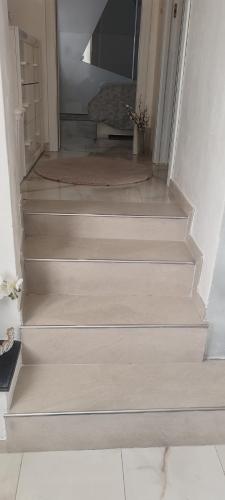 a set of stairs in a room with a stair case at Casetta sul mare in Savona
