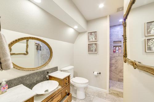 a bathroom with a sink toilet and a mirror at Rustic Hollister Cabin - 5 Mi to Downtown Branson in Hollister