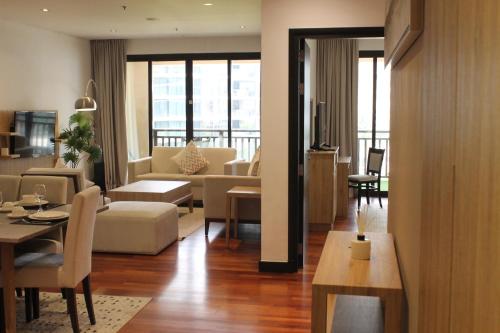 a living room with a couch and a table at Luxe Getaways Royal Amwaj Palm Jumeirah Resort Apartment Holiday Home in Dubai