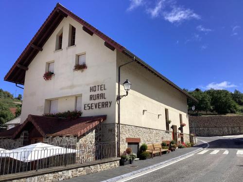 a building with a sign on the side of it at Hotel Rural Eseverry-Bosque Irati in Jaurrieta