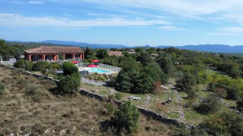 an aerial view of a house with a swimming pool at Les Villas de Perret in Joyeuse