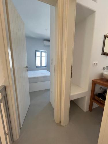a bathroom with a toilet and a sink at Amorgos Elegant Houses, 6 Villas in Amorgos
