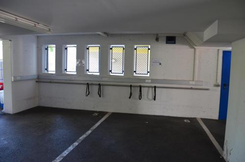 an empty room with a row of windows on the wall at Kolpinghaus Spittal in Spittal an der Drau