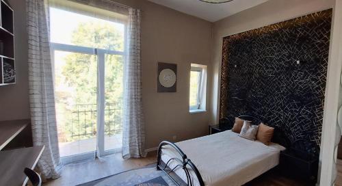 Ένα ή περισσότερα κρεβάτια σε δωμάτιο στο apartament na 5