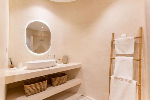 a bathroom with a sink and a mirror at NJ House in Tangier