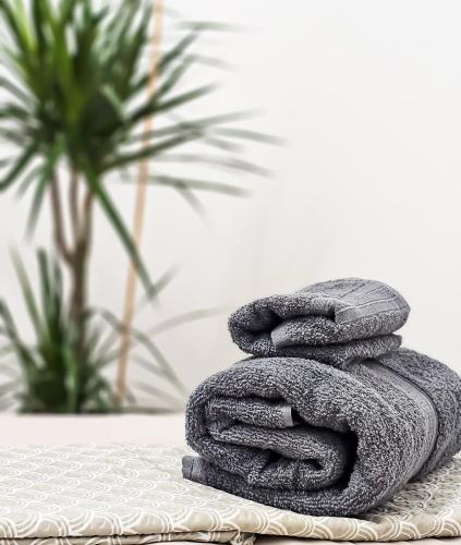 a pile of towels sitting on top of a table at Tirana Heart Lodge in Tirana