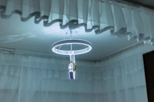 a chandelier hanging from the ceiling in a room at Rustic Paradise Apartments in Kisumu