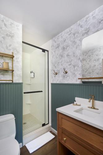 a bathroom with a shower and a sink at The Sagaponack in Sagaponack